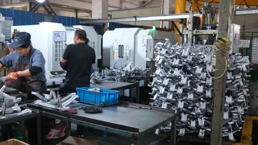 Machining and finishing of washing machine spider castings at Meituo Metal workshop